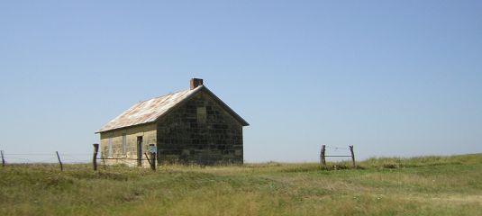 building in a field near Skiddy
